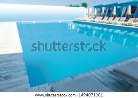 Blurred view of clean swimming pool on sunny day