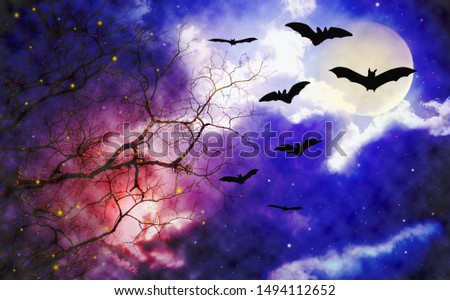 night sky with flying bats and dried tree, halloween theme