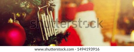 Decorated Christmas tree and Santa silhouette beside it, Christmas background