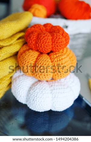 Knitted pumpkins. Cozy comfort, autumn fall home decorating ideas, thanksgiving.