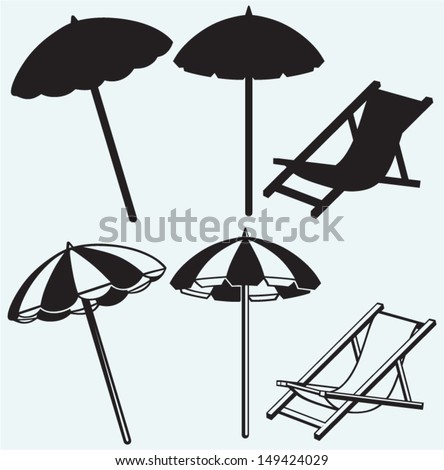 Chair and beach umbrella isolated on blue background