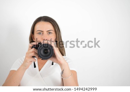 
Beautiful woman making photos and smiling