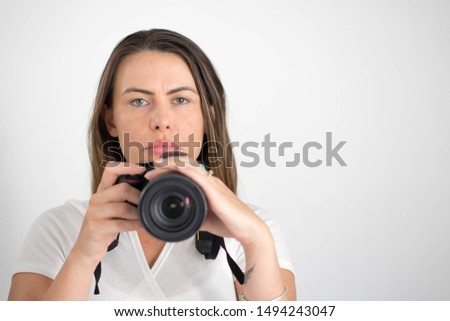 
Beautiful woman making photos and smiling