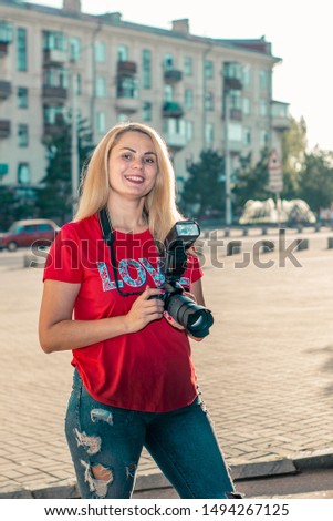 young woman photographer in the city