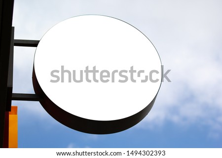 Shop signboard mockup. Street store exterior circle sign on sky background