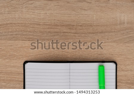 Close up view of notebook with marker