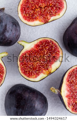 background the figs close-up half of the figs top view white background Royalty-Free Stock Photo #1494324617