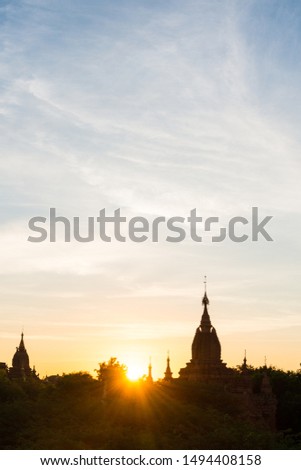 Vertical picture of the sunlight and sky with clouds during sunrise time in Bagan, Myanmar