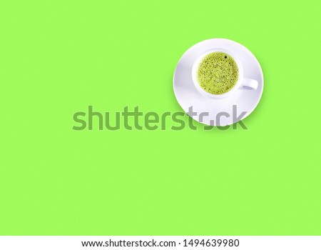 Cardboard cup of coffee on  neon background, neon filter, neon colors, copy space, top view