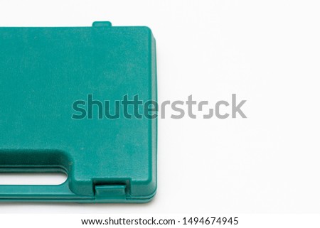 green suitcase on a white background, free space for text