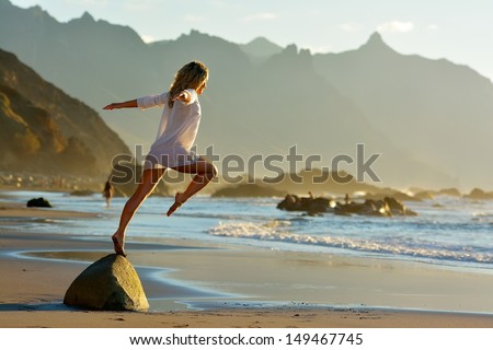 young woman on the beach in summer