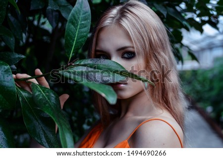 Beauty portrait of young girl in the garden