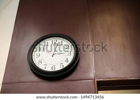A Clock Black and White with Wall