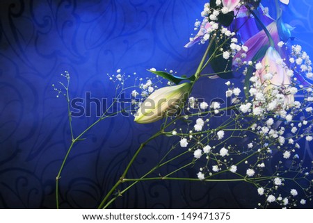 Magic bouquet. Beautiful flowers and color smoke on dark background.
