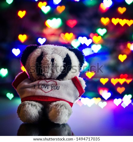 teddy bear with I love you T-shirt with heart bokeh