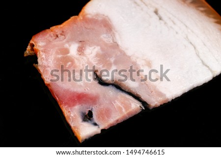 ham sliced on black background