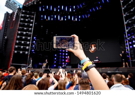 Video recording on a mobile phone, concert show