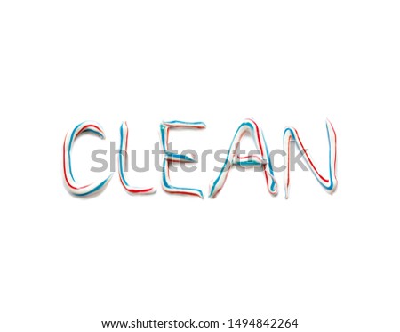 The word „clean“ written with  blue, red and white striped toothpaste, toothpaste letters