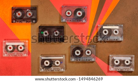 Vintage music cassette tape on retro background. Flat lay. 70's, 80's, 90's old school record technology poster.