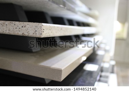 Samples of worktops stacked up in a showroom Royalty-Free Stock Photo #1494852140