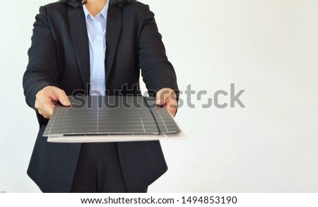 Business woman in black suit send a document folder from her hand on white background and copy space.