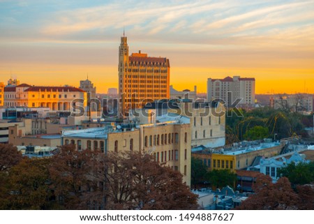 Historic buildings in downtown San Antonio including Emily Morgan Hotel at sunrise twilight in downtown San Antonio, Texas, USA.