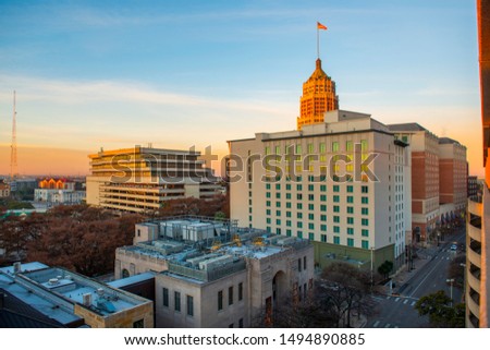 San Antonio city skyline including Hotel Contessa, Westing Riverwalk, Tower Life Building and San Antonio Museum of Art at sunrise in downtown San Antonio, Texas, USA.
