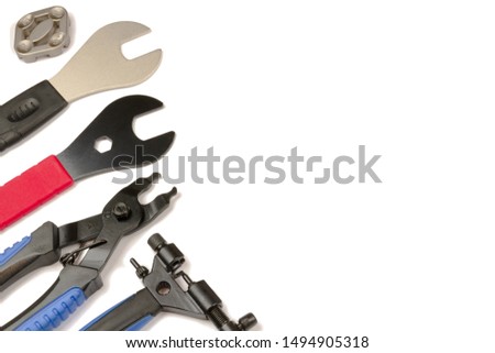 The new bike tool. Set of professional bicycle tools on an isolated white surface.