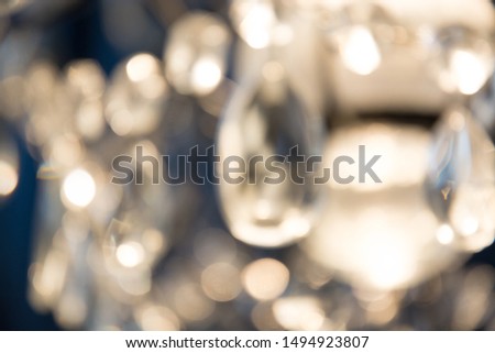 Blurred golden garland. City night light blur bokeh, defocused background. Christmas and holiday abstract.