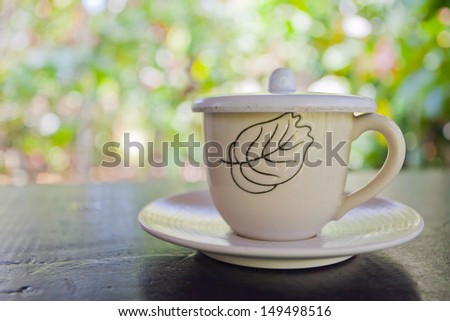 Image of one small white cup, filled with aromatic luwak coffee in Bali Plantage, Indonesia.