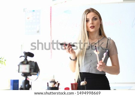 Female Blogger Portrait Makeup Product Review. Attractive Young Woman Recording Beauty Vlog. Alone Girl Giving Cosmetic Advice Filming Process on Digital Camera. Online Translation at Home
