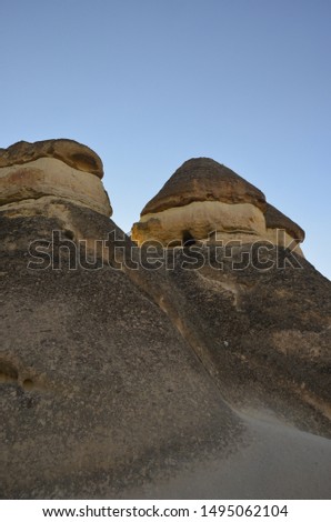 Beautiful fungous forms of sandstone in the canyon. Magic Cappadocia, near Cavusin village, Nevsehir Province in the Central Anatolia Region of Turkey, Asia. Beauty of nature. Concept background