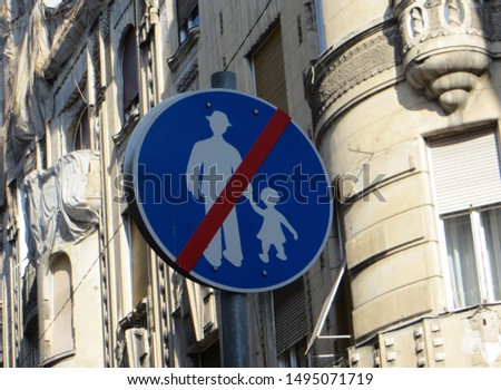 Traffic sign indicating that you are leaving the area where the kids are. Pedestrian traffic sign with an adult and child, Budapest, Hungary.
