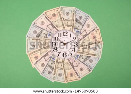Concept of clock and dollar. Clock on mandala kaleidoscope from money. Abstract money background raster pattern repeat mandala circle. On green background.