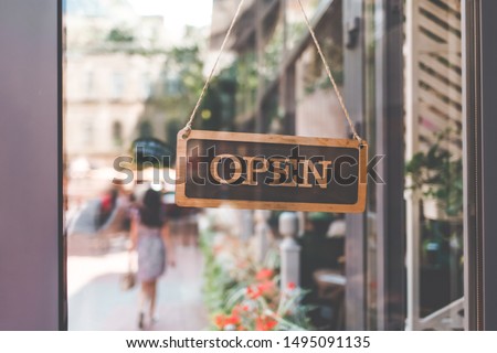 sign come in open on the door of the restaurant. open signboard  Royalty-Free Stock Photo #1495091135