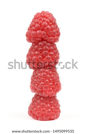 Four raspberries stacked on top of each other, isolated on white background. High resolution photo. Full depth of field.