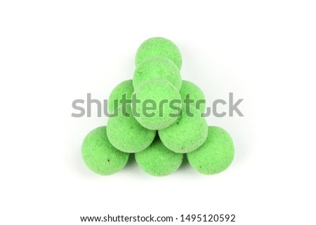 Close up view of green boilies, fishing baits for carp isolated on white background. High resolution photo. Full depth of field.