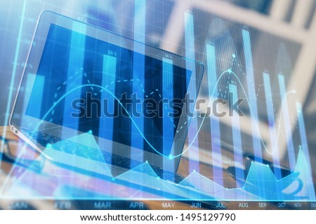 Stock market graph on background with desk and personal computer. Multi exposure. Concept of financial analysis. Royalty-Free Stock Photo #1495129790