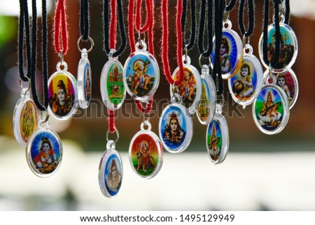 Hindu God and Goddesses pendant for sell in street market.