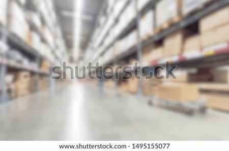Blurred abstract background Row of brown boxes on shelves in a manufacturing storage warehouse.