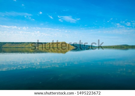 beautiful calm scenery landscape Ukrainian country side national reservation territory view with Dniester river smooth water surface and hill land horizon background in clear summer weather time  