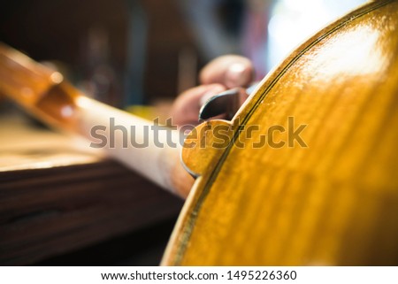 Process of fabrication of a violin, with tools
