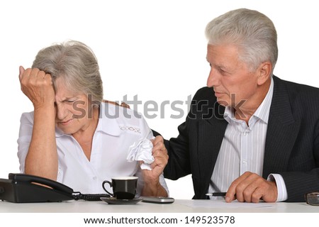 elderly couple in the workplace on a white background
