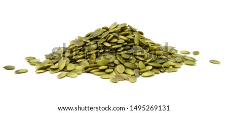Pumpkin seeds or pepitas, isolated on white background. Overhead view. - Image 