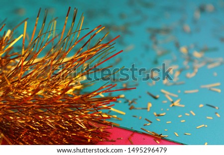 Tinsel, sparkles. New Year or Christmas, concept, contrast, colorful background. Bokeh effect, copy space. Greeting card template or layout for design.