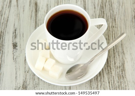 Cup of coffee, on color wooden background