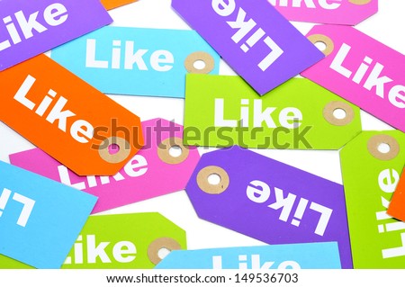 a pile of paper labels of different colors with the word like written on them