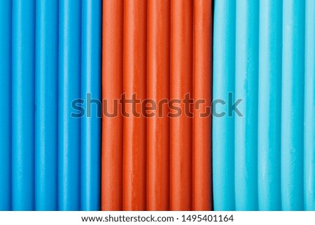 Soft clay from briquettes of cyan, brown and blue for modeling. Plastic colorful material for children art education. Close-up full screen, texture. Harmonious colors