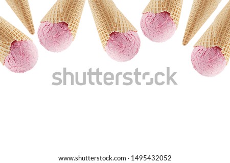 Summer food decorative border of delicious pink ice cream in crisp waffle cones isolated on white background.