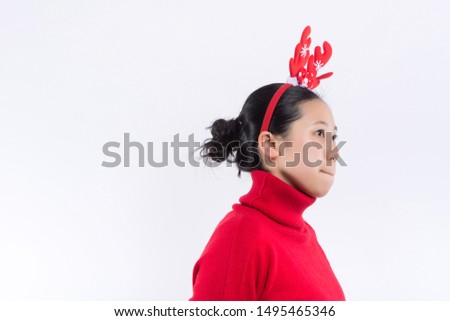Cute red-haired girl in stylish winter hat expressing happiness in christmas. Attractive young woman in sweater and skirt enjoying new year photoshoot.